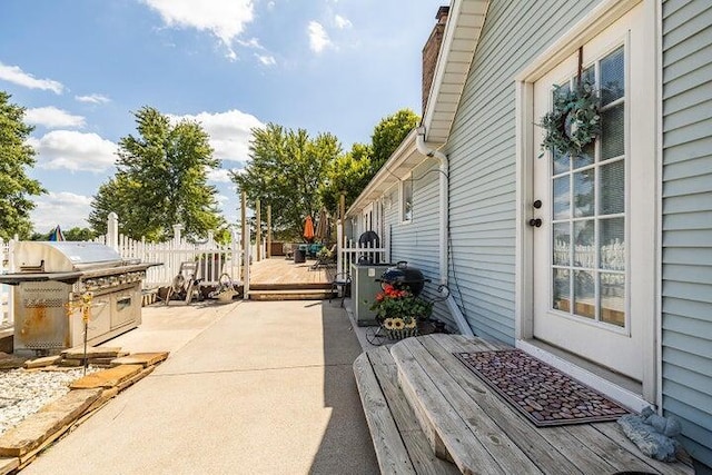 4402 Quail Run Rd, Ozark, MO 65721 - view of patio / terrace featuring a deck and an outdoor kitchen