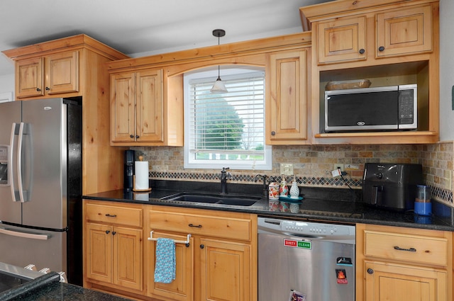 4402 Quail Run Rd, Ozark, MO 65721 - kitchen featuring stainless steel appliances, a sink, tasteful backsplash, and decorative light fixtures