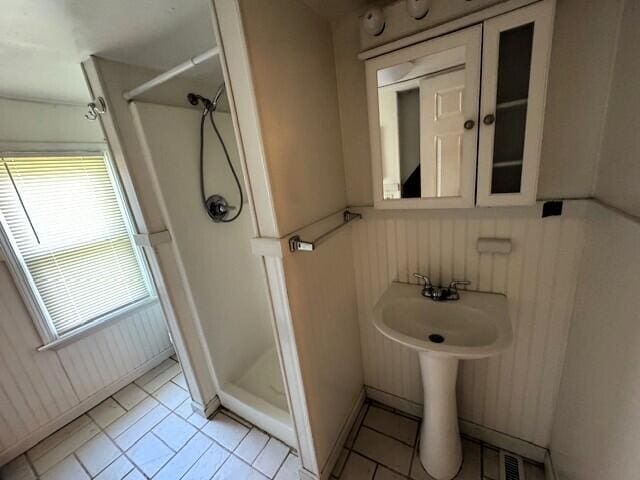 1211 W Calhoun St, Springfield, MO 65802 - bathroom with a shower stall and tile patterned floors