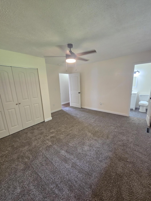 2460 S National Ave, Springfield, MO 65804 - unfurnished bedroom with carpet, a closet, a textured ceiling, baseboards, and ceiling fan