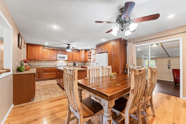 19326 Boat Dock Rd W, Omaha, AR 72662 - dining room with ceiling fan, light wood finished floors, baseboards, a textured ceiling, and recessed lighting