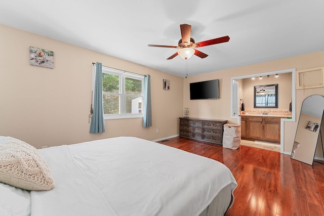 19326 Boat Dock Rd W, Omaha, AR 72662 - bedroom featuring wood finished floors, connected bathroom, baseboards, and a ceiling fan