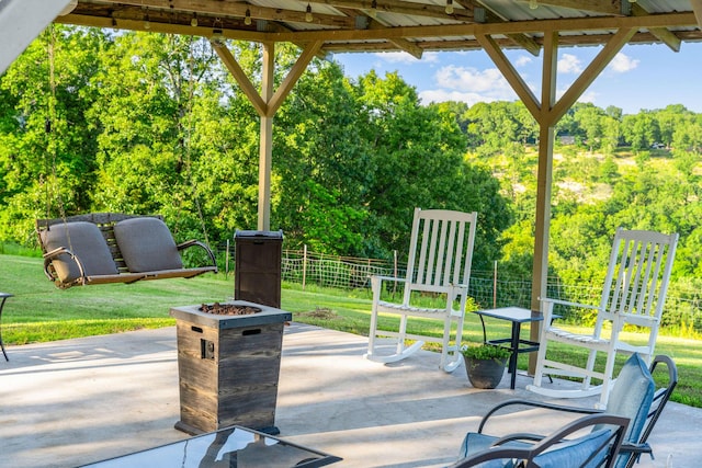 19326 Boat Dock Rd W, Omaha, AR 72662 - view of patio featuring an outdoor fire pit and view of wooded area