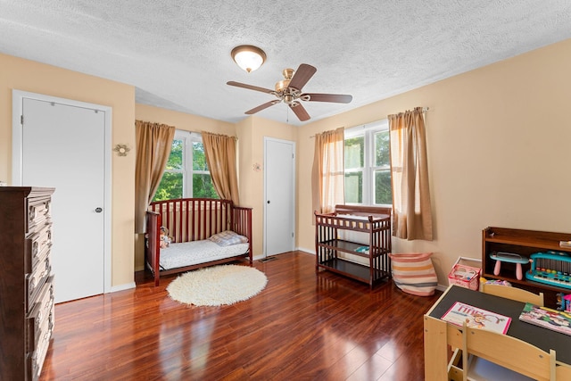 19326 Boat Dock Rd W, Omaha, AR 72662 - bedroom featuring wood finished floors, a textured ceiling, and baseboards