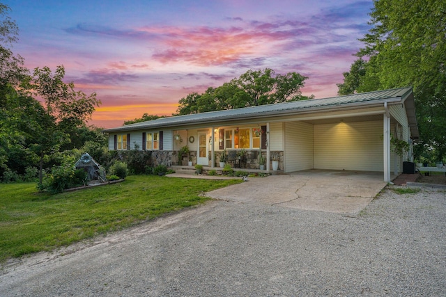 19326 Boat Dock Rd W, Omaha, AR 72662 - single story home featuring driveway, a front lawn, a porch, a carport, and metal roof