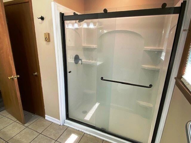 1208 Oak Ridge Dr, Aurora, MO 65605 - full bathroom with tile patterned floors, a shower stall, and baseboards