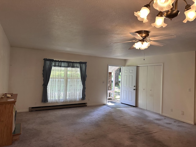 130 Wichita Ave, Forsyth, MO 65653 - carpeted entryway featuring baseboard heating, baseboards, a textured ceiling, and a ceiling fan