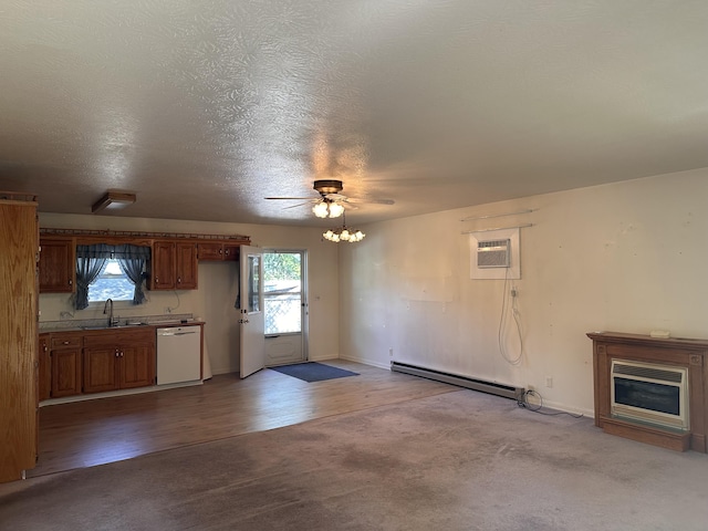 130 Wichita Ave, Forsyth, MO 65653 - unfurnished living room with a baseboard heating unit, a sink, a wall unit AC, ceiling fan, and dark carpet