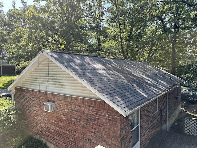 130 Wichita Ave, Forsyth, MO 65653 - view of side of property with brick siding and a shingled roof