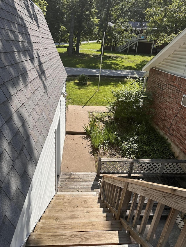 130 Wichita Ave, Forsyth, MO 65653 - wooden terrace featuring a lawn, stairs, and view of scattered trees