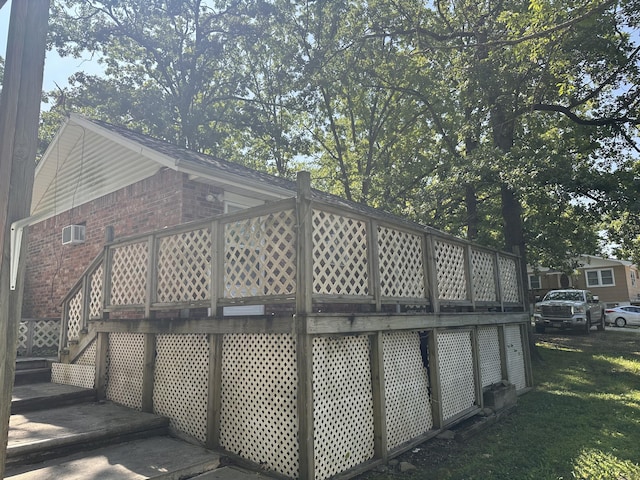 130 Wichita Ave, Forsyth, MO 65653 - view of home's exterior with brick siding, a deck, and stairway