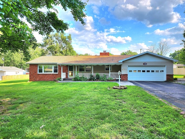 688 W Swan St, Springfield, MO 65807 - ranch-style house featuring brick siding, covered porch, asphalt driveway, an attached garage, and a chimney