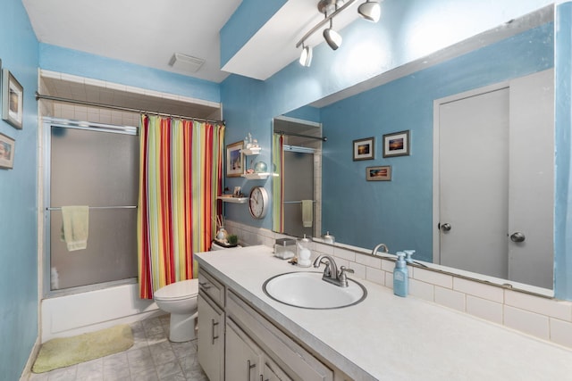 5527 S Honeysuckle Ln, Battlefield, MO 65619 - full bath with toilet, shower / bath combo with shower curtain, and vanity