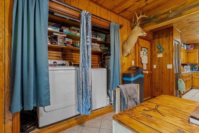 206 Plum St, Sparta, MO 65753 - dining area featuring washer and clothes dryer, light tile patterned flooring, wooden walls, and wood ceiling
