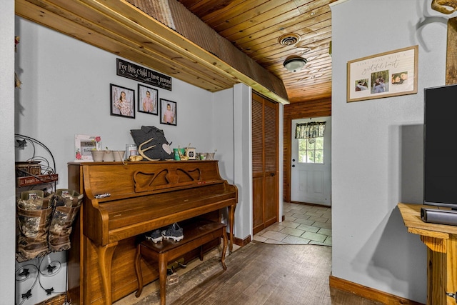 206 Plum St, Sparta, MO 65753 - living area with wooden ceiling, wood finished floors, and baseboards