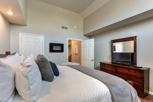 280 Wimbledon Dr Unit 9, Branson, MO 65616 - bedroom featuring high vaulted ceiling, wood finished floors, and baseboards