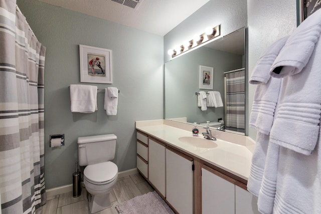 280 Wimbledon Dr Unit 9, Branson, MO 65616 - bathroom featuring toilet, vanity, and baseboards