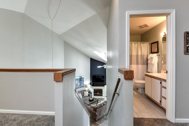 280 Wimbledon Dr Unit 9, Branson, MO 65616 - corridor with lofted ceiling, a sink, and baseboards
