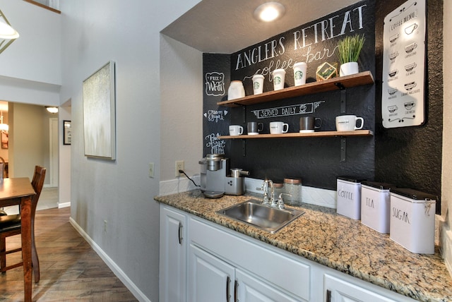 280 Wimbledon Dr Unit 9, Branson, MO 65616 - indoor wet bar with dark wood-type flooring and baseboards
