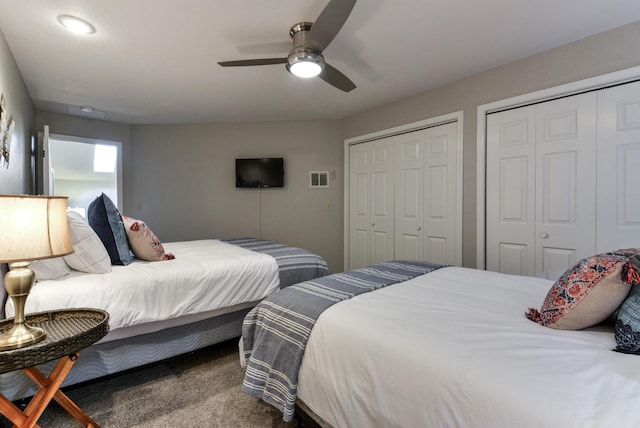 280 Wimbledon Dr Unit 9, Branson, MO 65616 - carpeted bedroom featuring two closets and ceiling fan