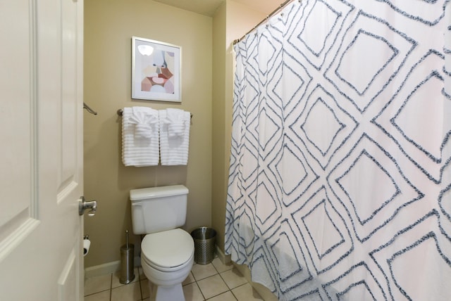 318 Wimbledon Dr Unit 8, Branson, MO 65616 - bathroom featuring toilet, tile patterned floors, baseboards, and a shower with curtain