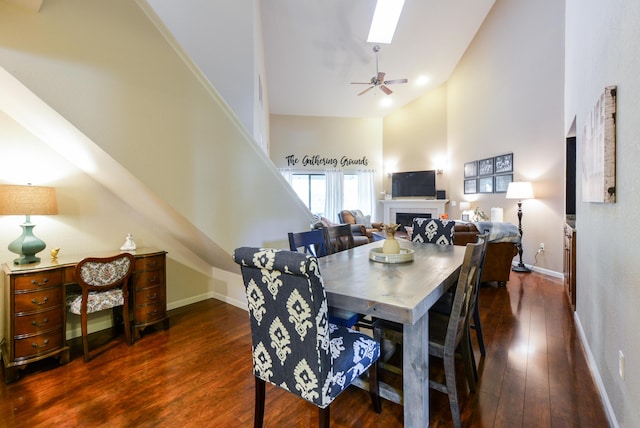 318 Wimbledon Dr Unit 8, Branson, MO 65616 - dining room with high vaulted ceiling, a skylight, hardwood / wood-style flooring, baseboards, and a ceiling fan