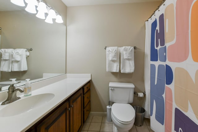 318 Wimbledon Dr Unit 8, Branson, MO 65616 - bathroom featuring tile patterned flooring, toilet, vanity, a shower with curtain, and baseboards