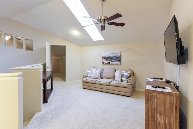 318 Wimbledon Dr Unit 8, Branson, MO 65616 - living area featuring vaulted ceiling, a skylight, a ceiling fan, carpet flooring, and baseboards
