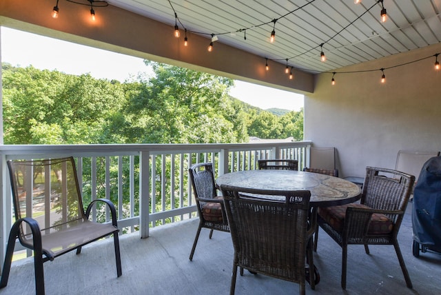 318 Wimbledon Dr Unit 8, Branson, MO 65616 - view of patio with a forest view and outdoor dining area