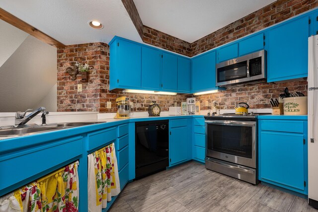 344 Wimbledon Dr Unit 7, Branson, MO 65616 - kitchen featuring appliances with stainless steel finishes, a sink, decorative backsplash, and blue cabinets