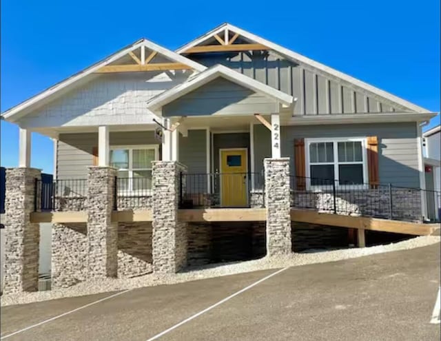 224 David Shawn Dr, Branson, MO 65616 - craftsman-style home with covered porch and board and batten siding