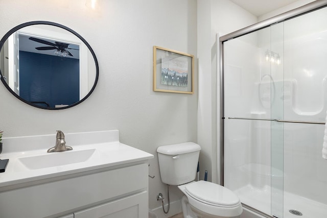 224 David Shawn Dr, Branson, MO 65616 - bathroom with ceiling fan, toilet, vanity, and a shower stall
