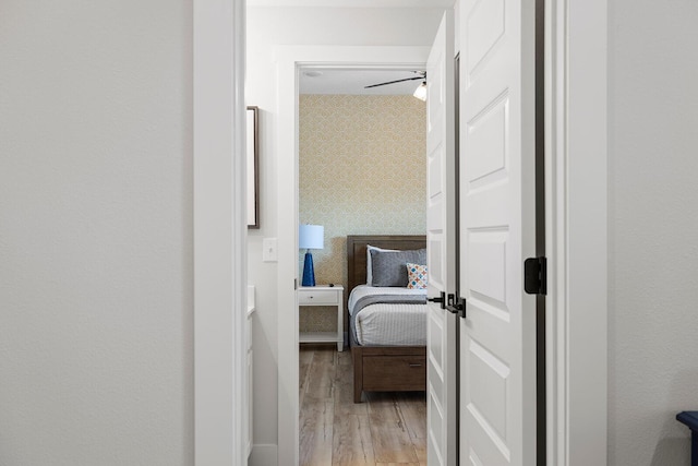 224 David Shawn Dr, Branson, MO 65616 - hallway featuring light wood-type flooring and wallpapered walls