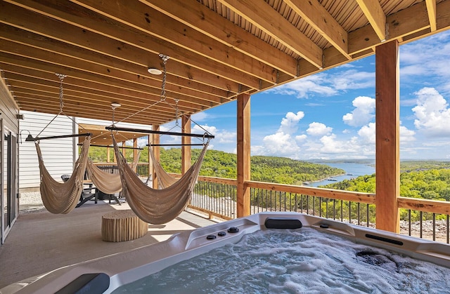224 David Shawn Dr, Branson, MO 65616 - view of patio / terrace with a water view and a hot tub