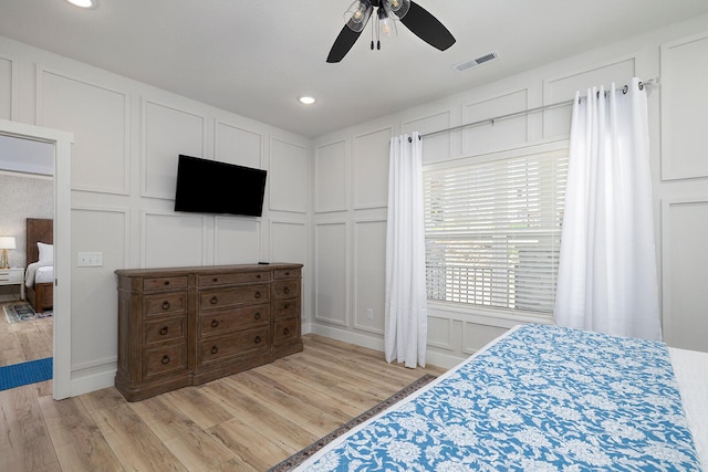 224 David Shawn Dr, Branson, MO 65616 - bedroom with a decorative wall, light wood-style flooring, recessed lighting, and ceiling fan