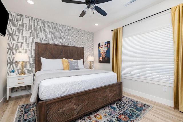 224 David Shawn Dr, Branson, MO 65616 - bedroom featuring baseboards, wood finished floors, an accent wall, recessed lighting, and a ceiling fan