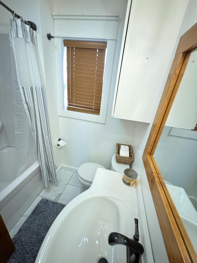 83 Dawn Cir, Galena, MO 65656 - bathroom featuring marble look tile flooring, shower / bath combination with curtain, toilet, and a sink