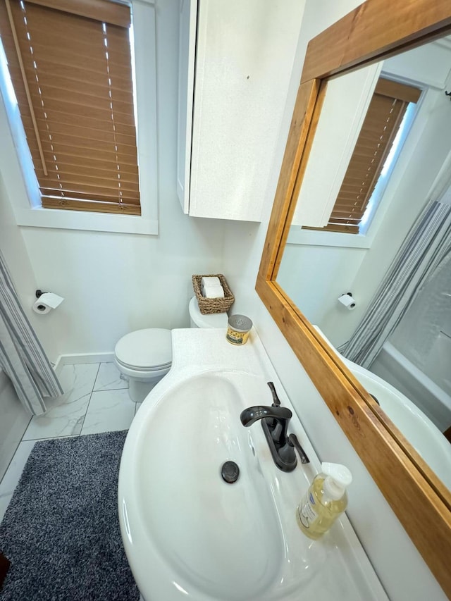 83 Dawn Cir, Galena, MO 65656 - bathroom featuring marble finish flooring, toilet, and a sink