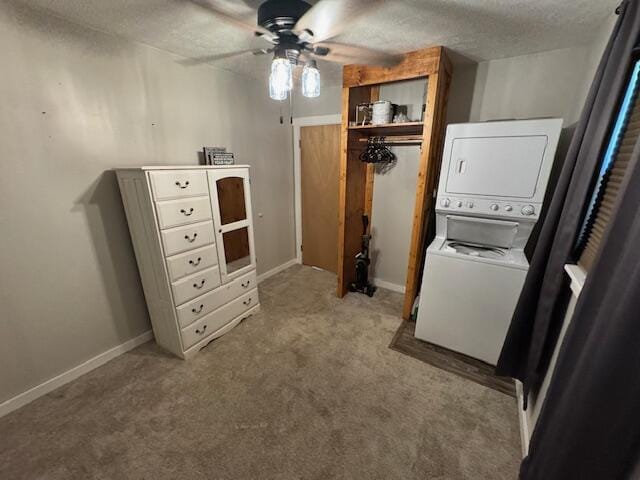 83 Dawn Cir, Galena, MO 65656 - laundry area featuring estacked washer and dryer, a ceiling fan, carpet, and a textured ceiling