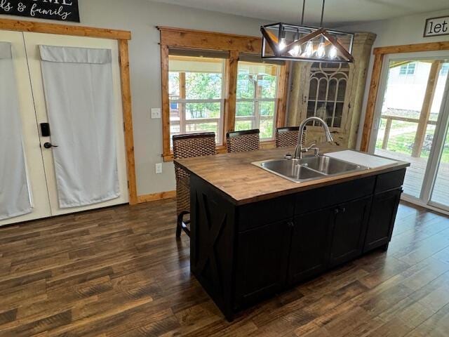 83 Dawn Cir, Galena, MO 65656 - kitchen featuring plenty of natural light, dark cabinets, and dark wood-style floors