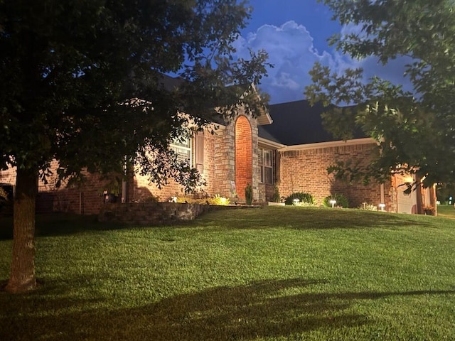 1002 S Joshua Ave, Republic, MO 65738 - view of front of property featuring a front yard, an attached garage, and stone siding