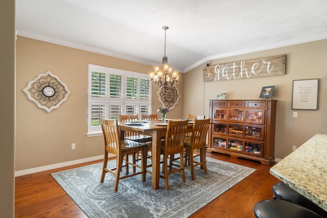 1002 S Joshua Ave, Republic, MO 65738 - dining space featuring ornamental molding, a chandelier, dark wood finished floors, and baseboards