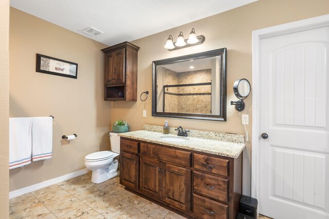 1002 S Joshua Ave, Republic, MO 65738 - full bathroom featuring baseboards, vanity, toilet, and tiled shower