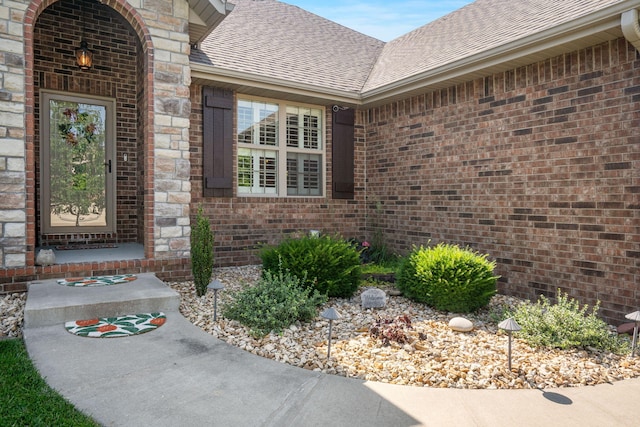 1002 S Joshua Ave, Republic, MO 65738 - entrance to property featuring a shingled roof and brick siding