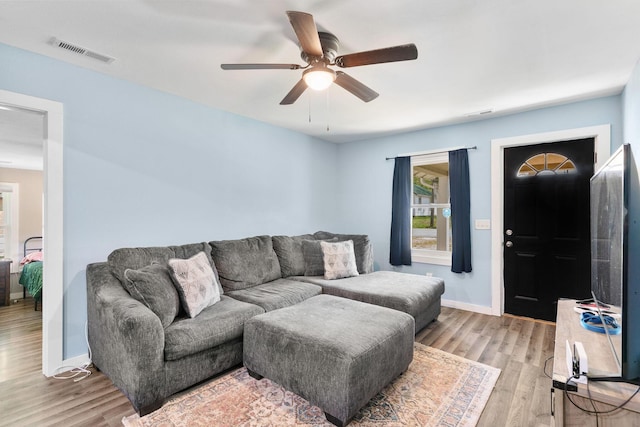 301 W Ramsey St, Buffalo, MO 65622 - living room featuring ceiling fan, light wood finished floors, and baseboards