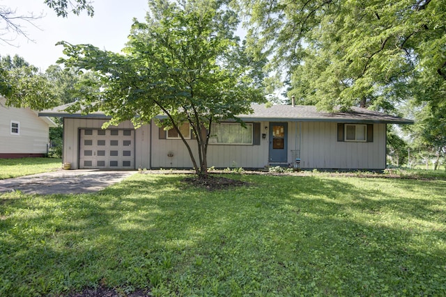 2812 W Lombard St, Springfield, MO 65802 - view of front of property featuring concrete driveway, a front yard, and an attached garage