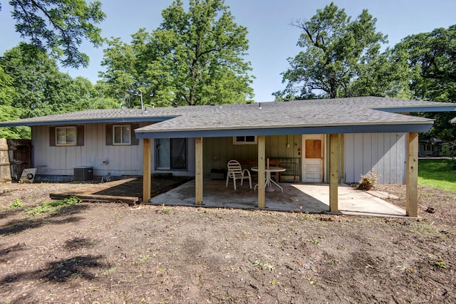 2812 W Lombard St, Springfield, MO 65802 - rear view of house with a patio, central air condition unit, and roof with shingles