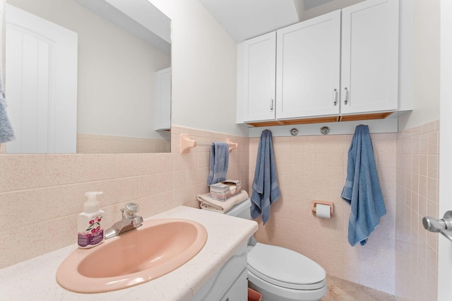 25630 Foxwood Cir, Shell Knob, MO 65747 - bathroom featuring toilet, vanity, tile walls, and a wainscoted wall
