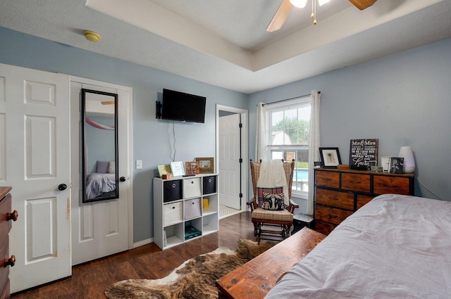 803 W Ridgecrest St, Ozark, MO 65721 - bedroom with wood finished floors, baseboards, a raised ceiling, and a ceiling fan
