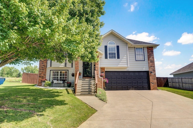 803 W Ridgecrest St, Ozark, MO 65721 - view of front of house featuring brick siding, an attached garage, and driveway